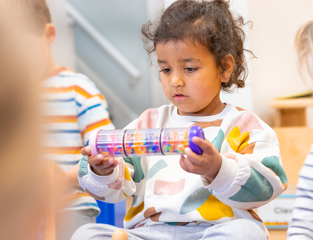 young girls plays with tool